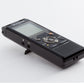 a black digital recorder sitting on top of a white table